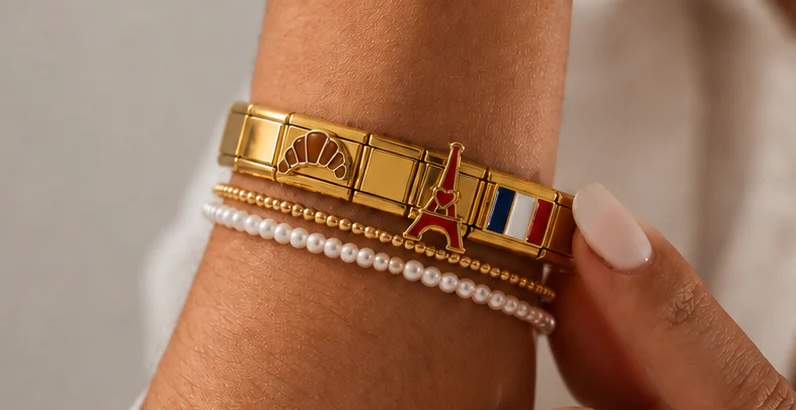 The Paris charm bracelet worn on a wrist